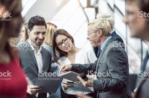 Business People on a Conference Event Discussing